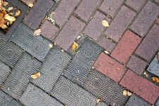 Two kinds of brick meet in a sidewalk in Savannah